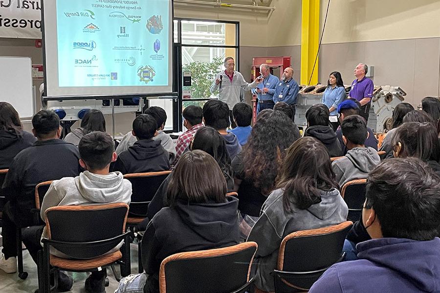 Group of students listening to George Sharpe speak on Energy.