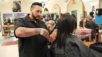 Hairdresser cutting hair.